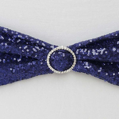Navy sequin bow with a silver ring detail