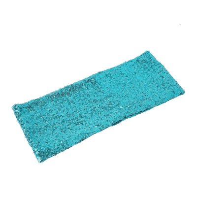 Turquoise sequin table runner on a white backdrop