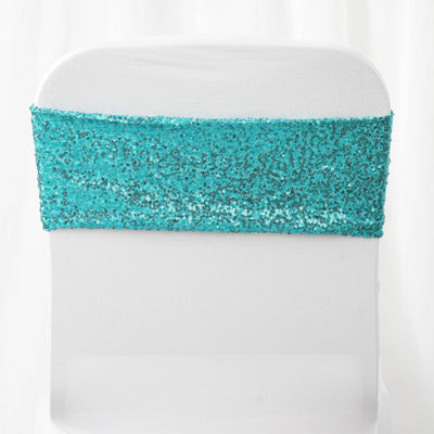 Turquoise sequin chair sash on a white chair cover
