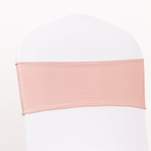 A fitted spandex chair sash in dusty rose