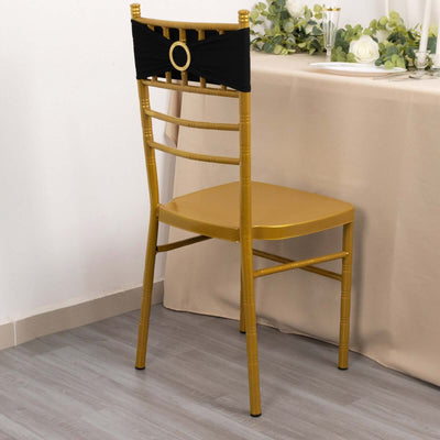 Gold chair with black bow decor, styled for an elegant dining setting.