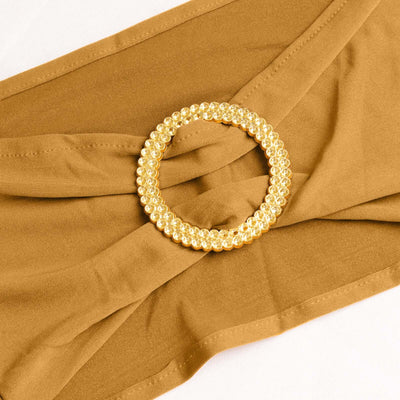 Brown fabric with a gold circular embellishment