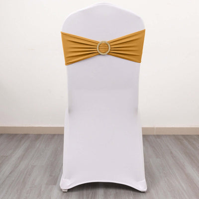 Gold chair cover sash with rhinestone buckle on a white chair.