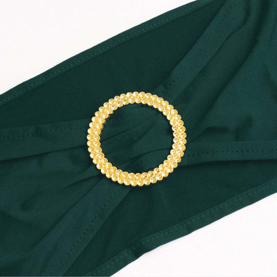 Green bikini top with a gold embellished circle detail.