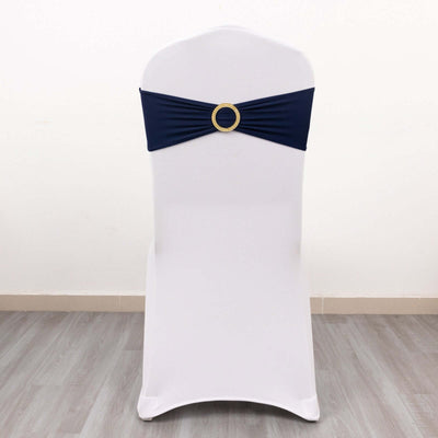 Navy chair cover with decorative ring on a white chair