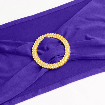 Purple fabric with a gold jeweled circle detail