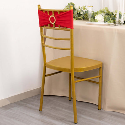 Gold chiavari chair with red sash, perfect for elegant events.