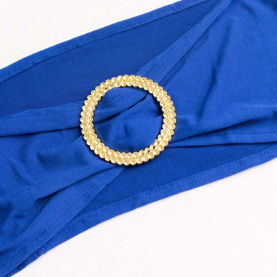 Blue fabric belt with a gold circular embellishment.