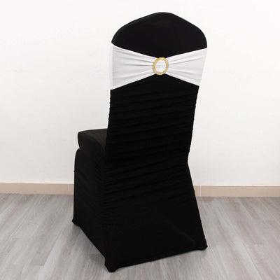 Black and white chair cover with ruched design and decorative embellishment