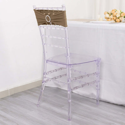 Clear chiavari chair with brown seat cover, perfect for elegant events.
