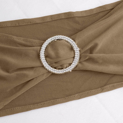 Brown fabric belt with a sparkling circular buckle detail.