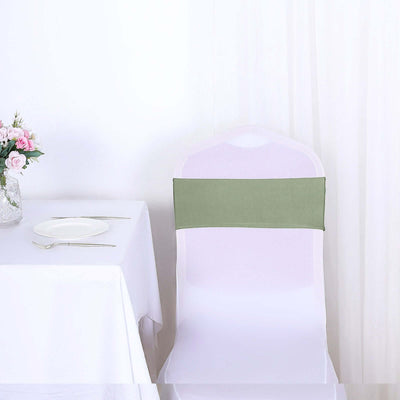 Green chair cover on a white chair at a table setting.