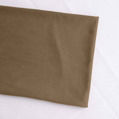 Brown fabric swatch folded neatly on a flat surface.