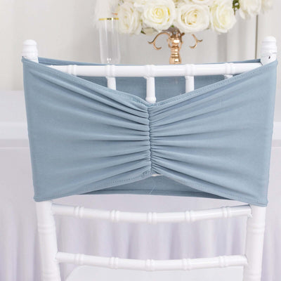 Blue chair cover with elegant ruched design for event decor.