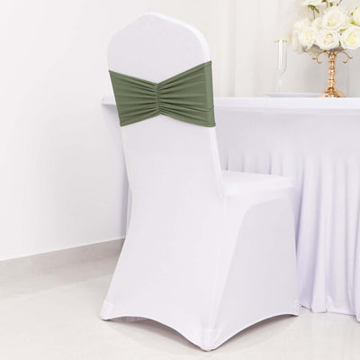 Elegant white chair cover with olive green sash for event decor