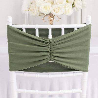 Green chair cover with gathered design for elegant event decor.