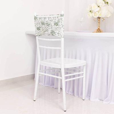 White chiavari chair with floral backrest, positioned at a table.