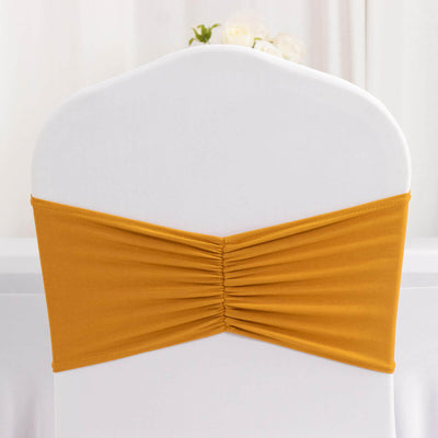 Gold chair sash with ruched design for elegant event decor.