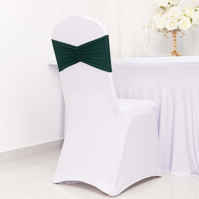 Green chair sash on a white chair at an elegantly set table.