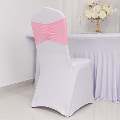 White chair cover with pink sash for elegant event decor
