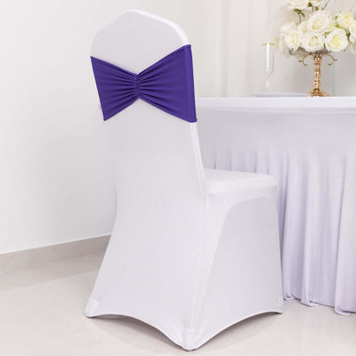 White chair cover with purple sash, ideal for event decoration.