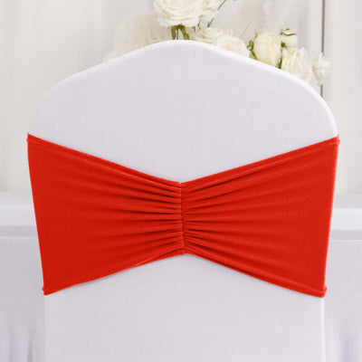 Red chair cover sash with pleated design for elegant event decor.