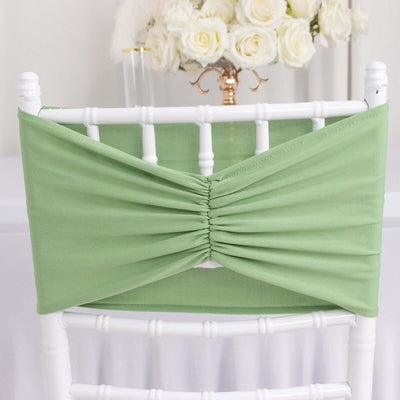 Green chair sash with gathered design for event decoration.
