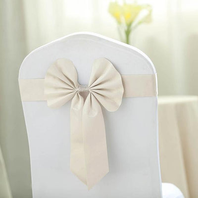 Elegant cream chair sash with bow, perfect for weddings and events.