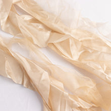 A close up of satin & taffeta chair sashes with a white background#whtbkgd