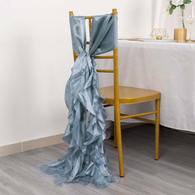 Elegant blue satin chair sash draped on a gold chair.