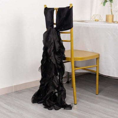 Black ruffled chair sash draped elegantly on a gold chair.