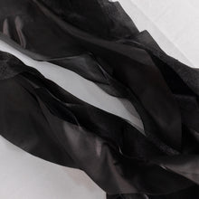 satin & taffeta chair sashes - black fabric laying on a white surface#whtbkgd