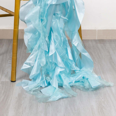 Light blue ruffled ribbon draping elegantly from a chair leg.