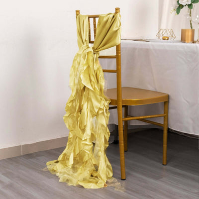 Yellow chiffon chair sash draping elegantly on a gold chair.