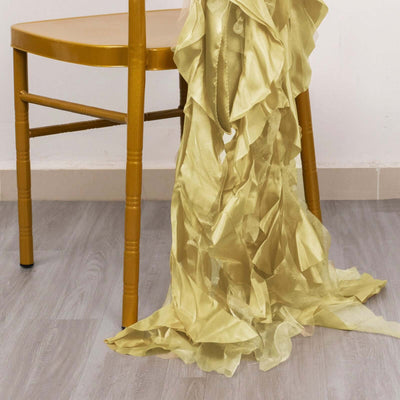 Gold ruffled fabric draped over a golden chair leg.