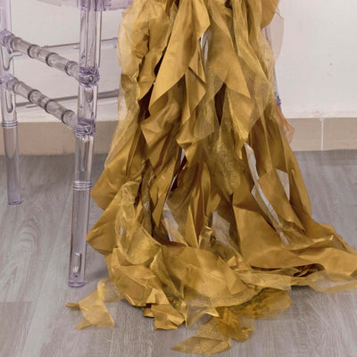 Gold ribbon streamers cascading from a chair.