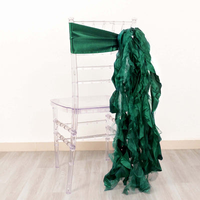 Green satin chair sash draped elegantly on a clear chiavari chair.