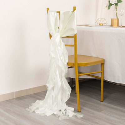 White satin chair sash draped elegantly on a gold chair.