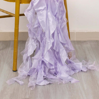 Purple silk fabric draped on a chair, showcasing its flowing texture.