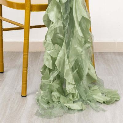 Green ruffled fabric draped on a chair leg.