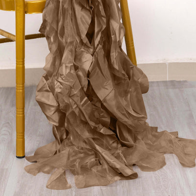 Brown crinkled fabric draped on a yellow chair leg.