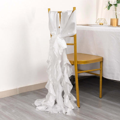 White chair sash draping elegantly on a gold chair at a stylish event.