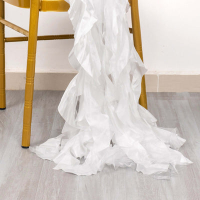 White ruffled fabric cascading from a golden chair.