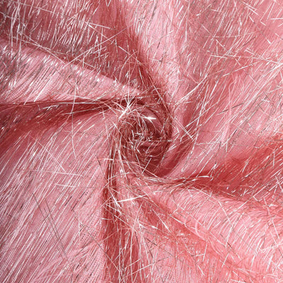 Pink fabric with metallic strands, showcasing a shimmering texture.