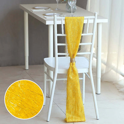 Yellow chair sash draped elegantly on a white chair at a dining table.