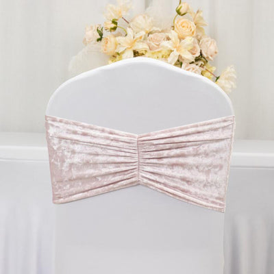 Pink velvet chair cover with pleated design against a white backdrop.