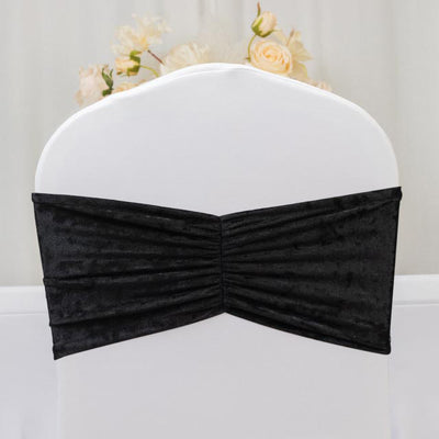 Black velvet chair cover with gathered design.