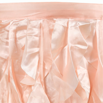 Pink satin ruffled fabric close-up showing soft texture and elegant draping.