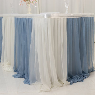 Elegant blue and white table skirt draping for events and celebrations.