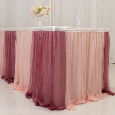 Elegant pink and burgundy table skirt for events and celebrations.